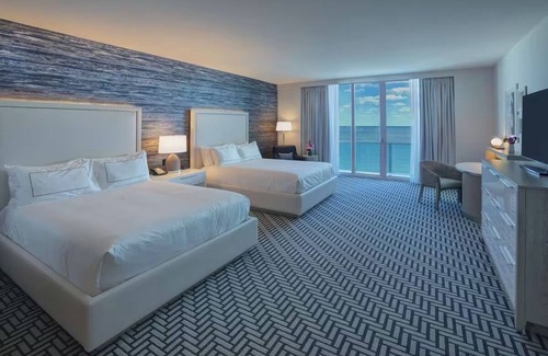 Central Beach Hotel | Airy Beach Retreat with Ocean Views Steps from Vibrant Nightlife Spots