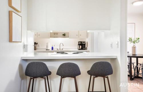 Hancock Apartment | Airy King Bedroom and Comfortable Living Space by UT
