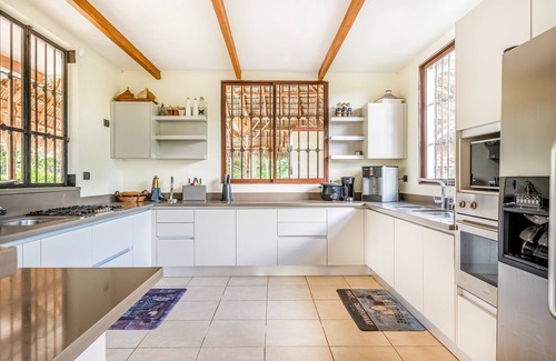 Coco House | Airy oasis with a grand outdoor space, private pool, & shared tennis court