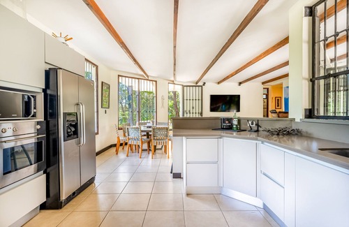 Coco House | Airy oasis with a grand outdoor space, private pool, & shared tennis court