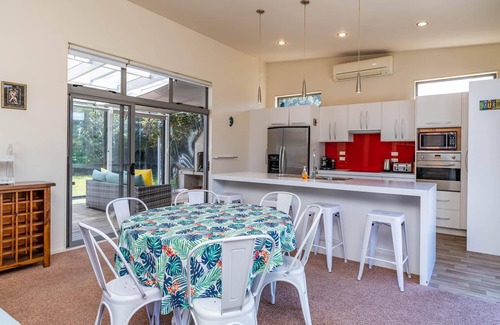 Mangawhai Heads House | All Decked Out - Modern holiday home with great covered outdoor entertaining space in handy location