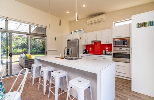 Mangawhai Heads House | All Decked Out - Modern holiday home with great covered outdoor entertaining space in handy location