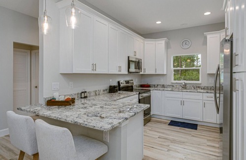 Port Malabar House | All new, lovely, spacious 3bd/2bth unit sleeps 10!