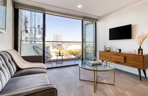 Avenida Revolucion Apartment | Amazing Apt w/a Pvt Balcony: Lounge-B/Center+Gym