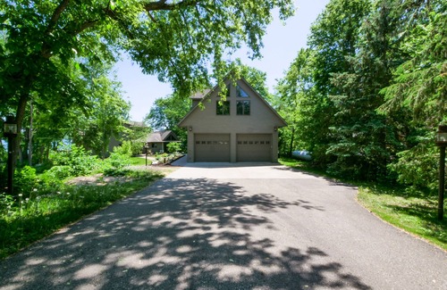 Alexandria Cabin | Amazing lake home on level lot with loft above garage paddle boat