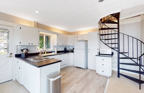 Harrison House | Amazing lake-view cabin with balcony, firepit, grill, wood stove, & W/D
