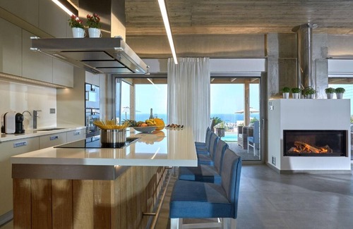 Vathianos Kampos Villa | Amazing location and views with a heated covered pool