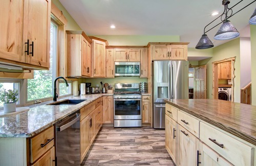 Tainter Lake House | Amazing River House with covered patio! Sleeps 10-14. Kayaks,Fireplace,Games.