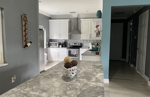 Greater Palm River Point CDC House | Amazing waterfront vacation home in Tampa -Gated, Heated pool
