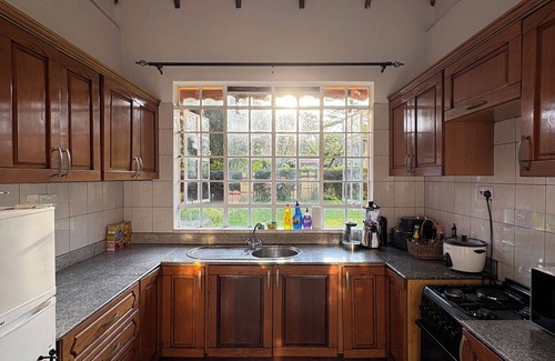 Arusha Villa | Amora Villa, Cozy home with a beautiful lush garden, swimming pool, fitness gym.