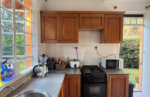 Arusha Villa | Amora Villa, Cozy home with a beautiful lush garden, swimming pool, fitness gym.