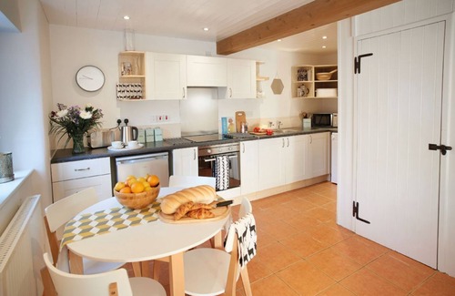 Ash Mill Cottage | An open plan cottage with a private patio with views of the countryside.