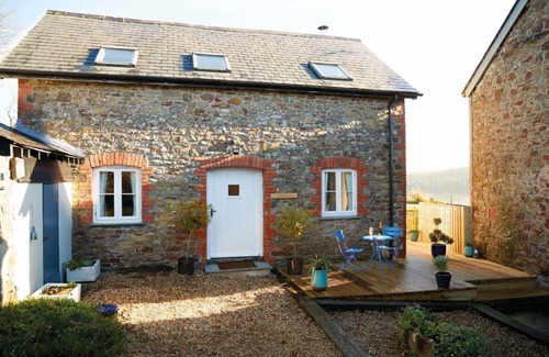 Ash Mill Cottage | An open plan cottage with a private patio with views of the countryside.