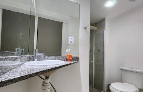 Camboinhas Apartment | Apart Hotel Alecrim Praia de Camboinhas with Marina standing on the sand