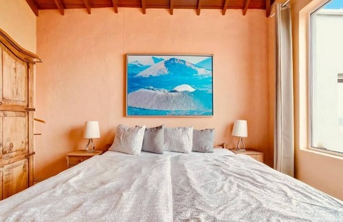 Teguise Resort | Apartment 1 with panoramic window in the bedroom facing the sea and Risco Famara
