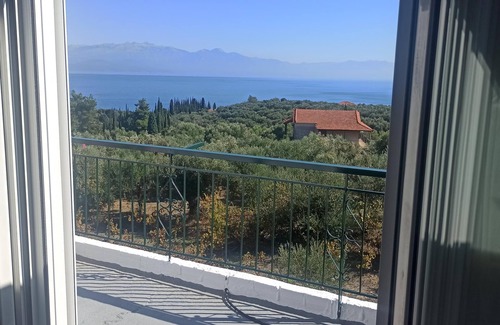 Kompi Apartment | Apartment above Peroulia beach near Koroni - taverna in front of the house