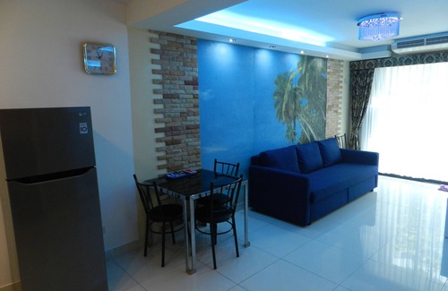 Jomtien Apartment | Apartment bedroom + living room.
