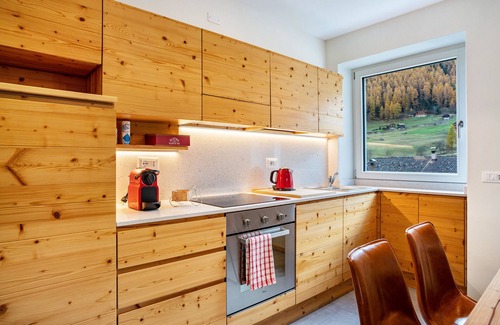 San Bernardo Apartment | Apartment 'Casa Vacanza Peter Val Di Rabbi' with Mountain View, Shared Garden and Wi-Fi