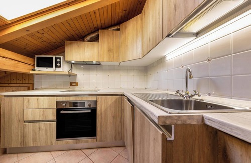 Vigo di Fassa Apartment | Apartment "Ciasa Sommavilla Mansarda" with Mountain View, Shared Garden & Wi-Fi