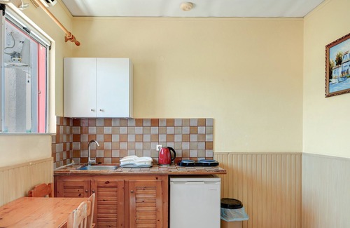 Tingaki Apartment | Apartment 'Golden Sun Two-bedroom Apt 1' with Sea View, Shared Pool and Wi-Fi