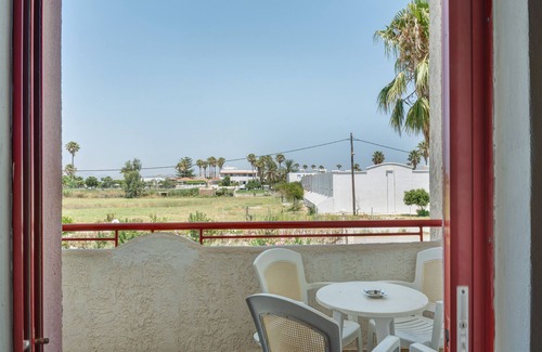 Tingaki Apartment | Apartment 'Golden Sun Two-bedroom Apt 1' with Sea View, Shared Pool and Wi-Fi