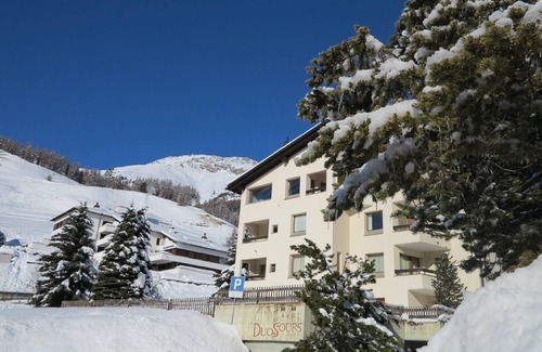 Celerina-Schlarigna Apartment | Apartment house on the hillside of Celerina.