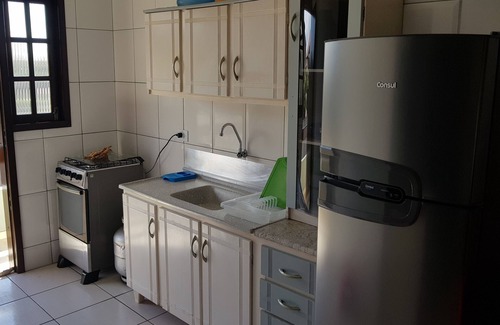 Itapoa Apartment | Apartment in gated community with pool.
