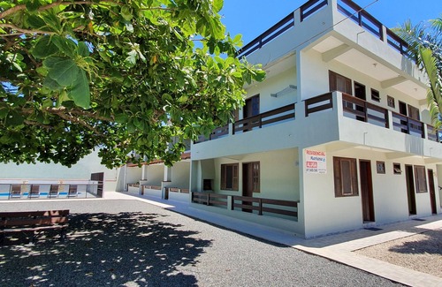 Itapoa Apartment | Apartment in gated community with pool.