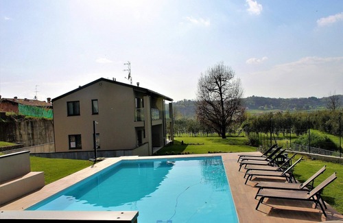 Torbiato di Adro Apartment | Apartment in Iseo with Pool Views