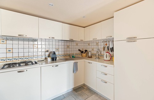 Bosa Historic Centre Apartment | Apartment 'Le Residenze In Piazza' with Balcony, Wi-Fi and Air Conditioning