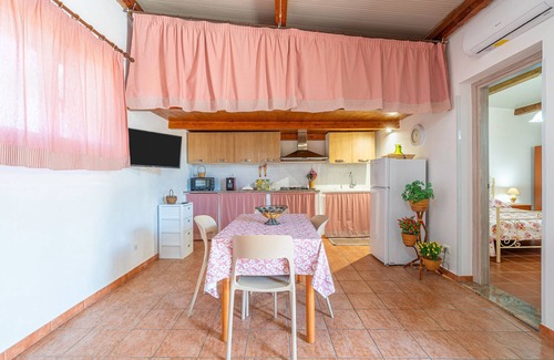 Granelli Apartment | Apartment 'Nonna Rosa' with Private Terrace, Shared Garden and Air Conditioning