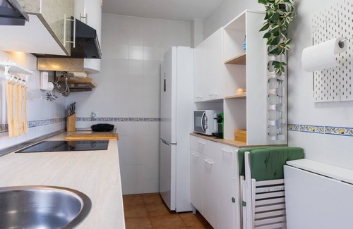 Pilas Apartment | Apartment 'Pilas' with Shared Pool, Wi-Fi and Air Conditioning