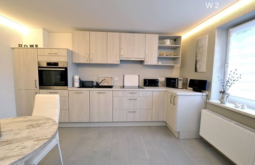 Babow Apartment | Apartment Rita 2, bedroom, living room, kitchen, shower/WC, outdoor seating area - Ferienwohnungen Rita