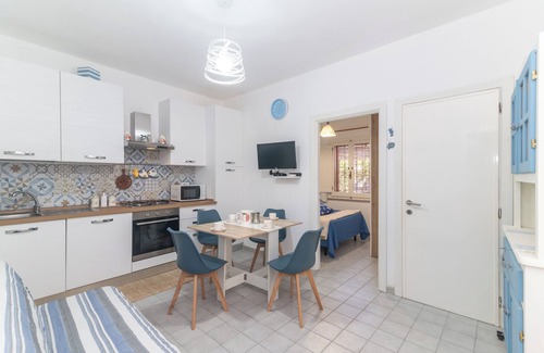 Porto Ottiolu Apartment | Apartment 'Soffio Di Mare' with Private Terrace, Private Garden and Air Conditioning