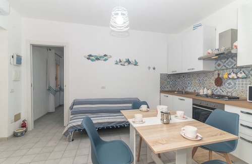 Porto Ottiolu Apartment | Apartment 'Soffio Di Mare' with Private Terrace, Private Garden and Air Conditioning