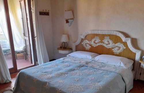 Capo Ferro House | Apartment with sea view 30 meters from the beach of Cala del Faro