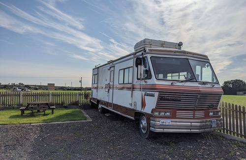 North Wheatley House | 'Arvey the American RV, parked on a picturesque campsite with its own garden