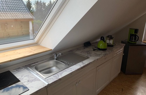 Wendisch Waren Apartment | Attic apartment Muttis Stübchen - two-room vacation apartment with eat-in kitchen