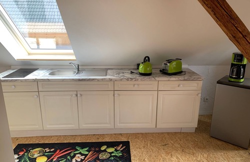 Wendisch Waren Apartment | Attic apartment Muttis Stübchen - two-room vacation apartment with eat-in kitchen