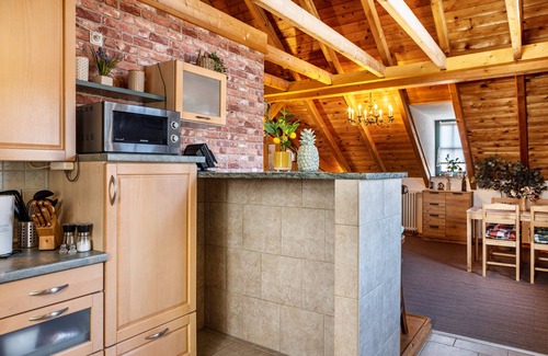 Dreißigacker Apartment | Attic Apartment in Country House Style