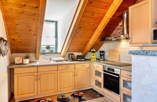 Dreißigacker Apartment | Attic Apartment in Country House Style