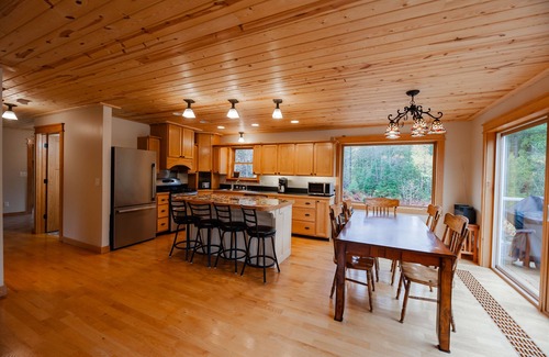 Champion House | ATV-Snowmobile Trail, Large home, sits on the peshekee river. sleeps 18 people.