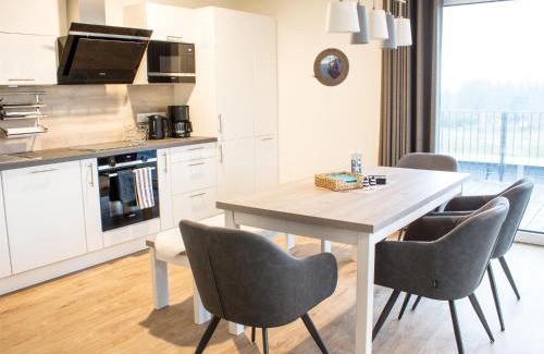 Butjadingen Apartment | Auszeit im Sielhuus - Familienfreundliche Ferienwohnung mit Dachterrasse und Sauna