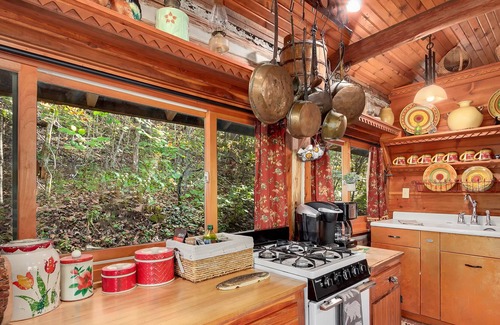 Eureka Springs Cabin | Authentic Lake Lucerne cabin with wrap-around deck, grill, wood stove, views