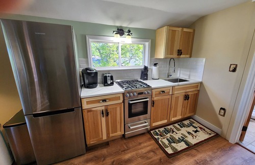 Lake Placid Apartment | Awesome mountain view with private patio, Fantastic location right on Main St.
