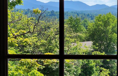 Lake Placid Apartment | Awesome mountain view with private patio, Fantastic location right on Main St.