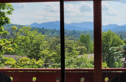 Lake Placid Apartment | Awesome mountain view with private patio, Fantastic location right on Main St.