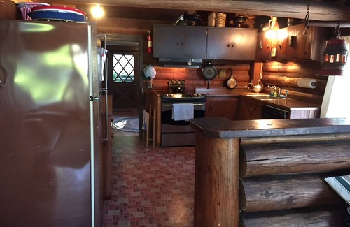 Rollingbay Cabin | Bainbridge Island Water's Edge Log Cabin just feet from the beach! Pet Friendly