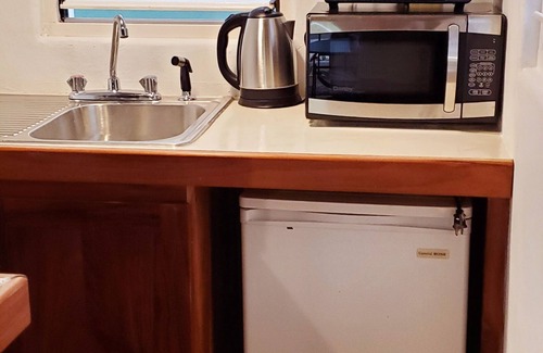 West End Cottage | Bak A Yaad Sapphire Blue Cottage