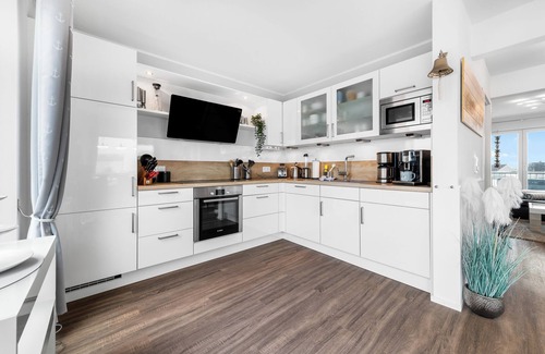 Olpenitz Apartment | Baltic Sea vacation apartment "HafenLounge" directly on the water with wellness bath & dream view